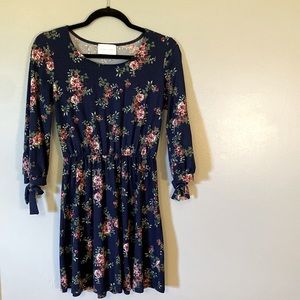 French Grey mini dress. Floral print. Bow tie 3/4 length sleeve. Size small.